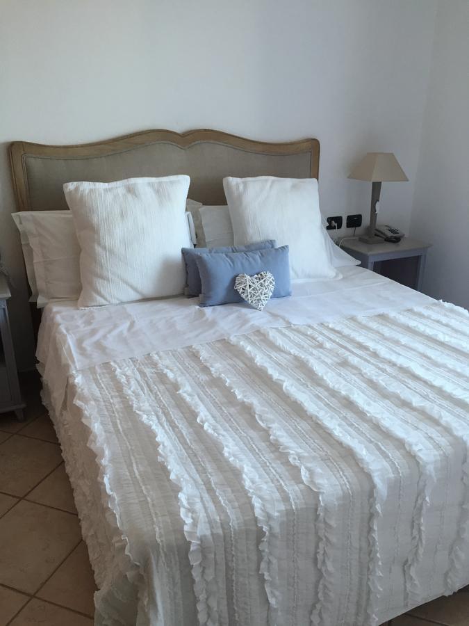 Relais Fenicottero Rosa Pensionat Porto Taverna Exteriör bild